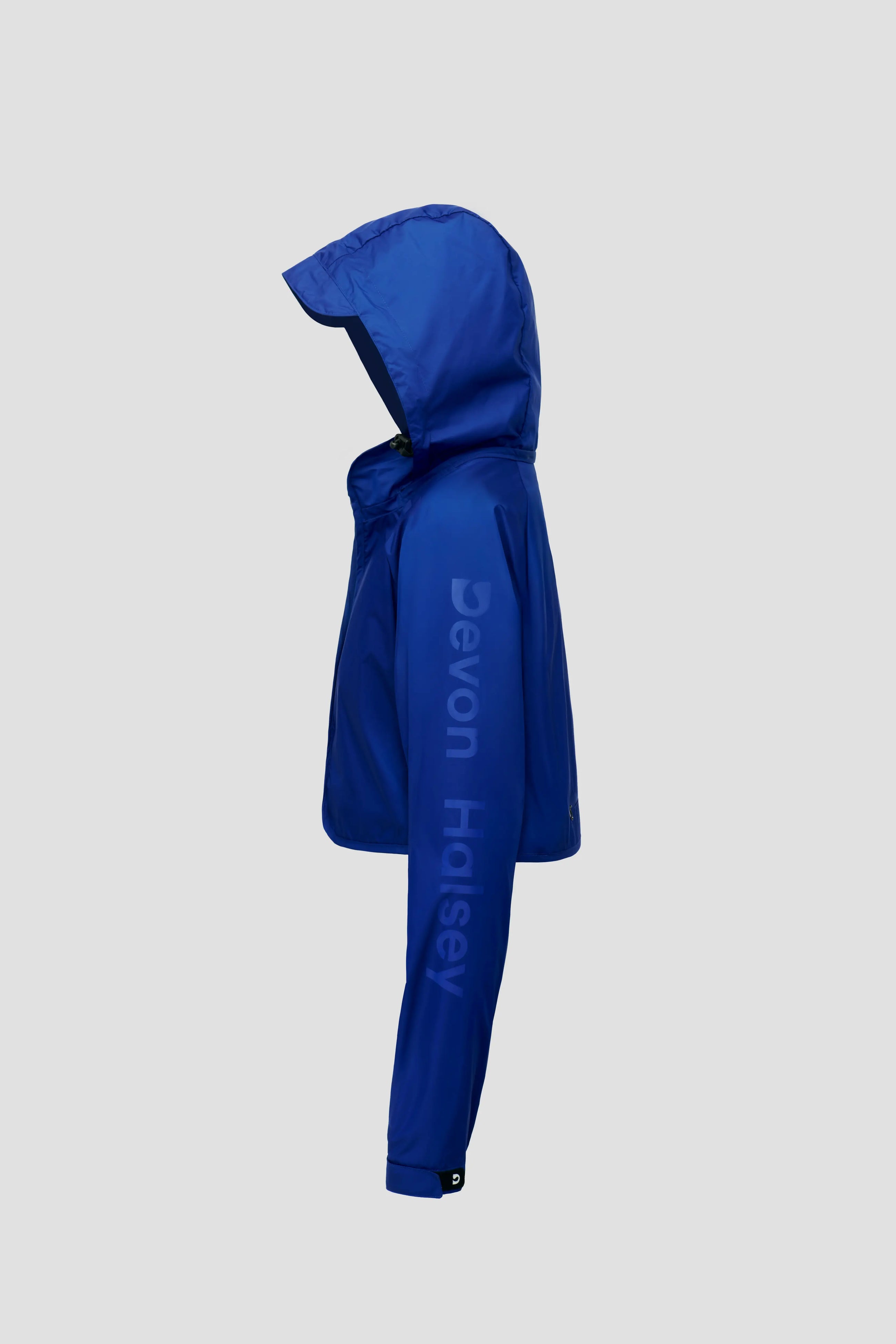 Blu hooded bolero jacket with 'Devon Halsey' branding on a light grey background