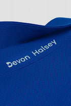 Blue classic polo pique knit fabric with 'Devon Halsey' branding