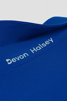 Blue classic polo pique knit fabric with 'Devon Halsey' branding