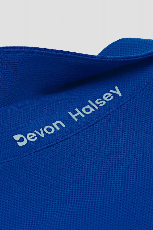 Blue classic polo pique knit fabric with 'Devon Halsey' branding