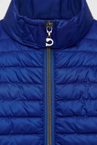 Close-up of a blue puffer jacket with a zipper