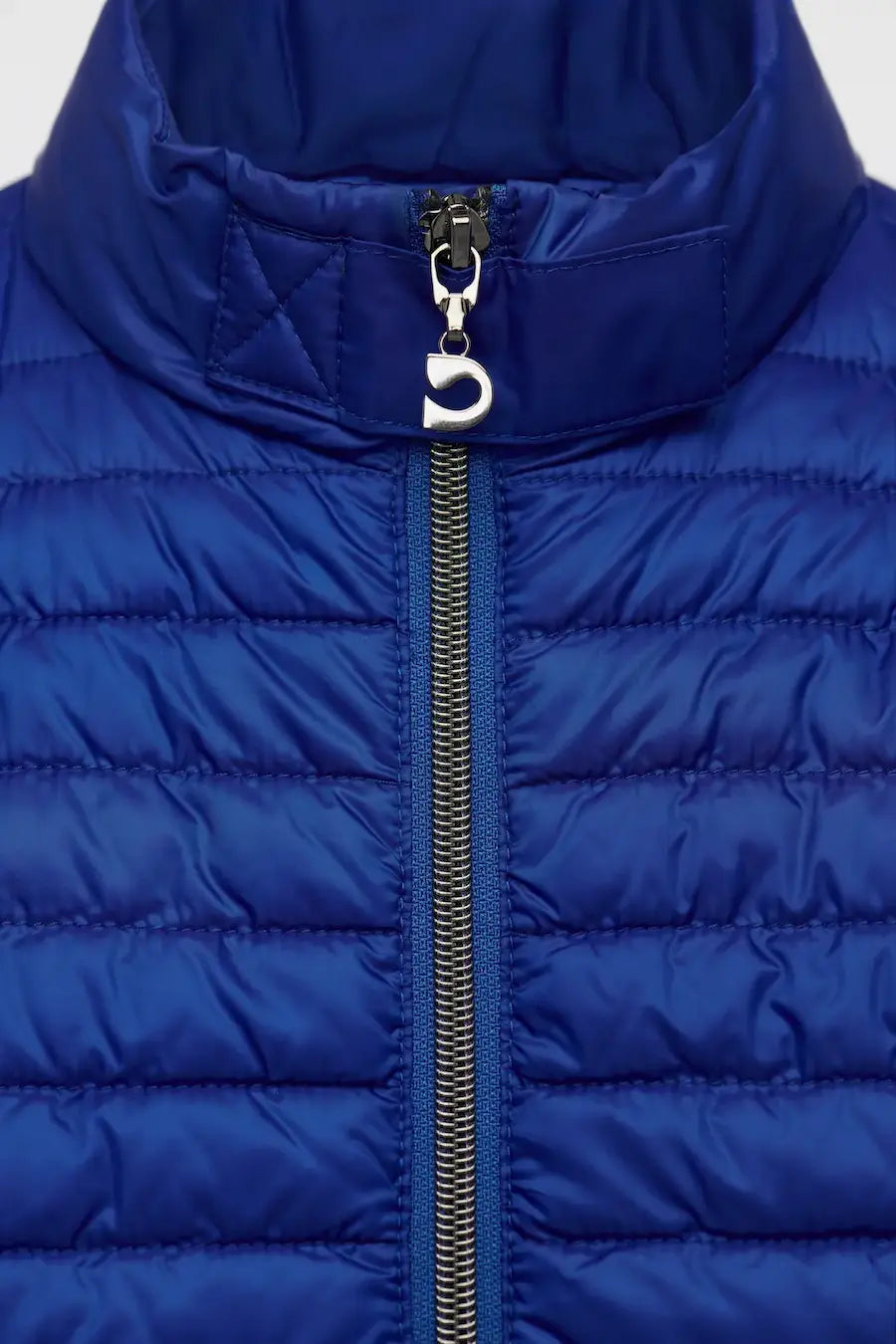 Close-up of a blue puffer jacket with a zipper