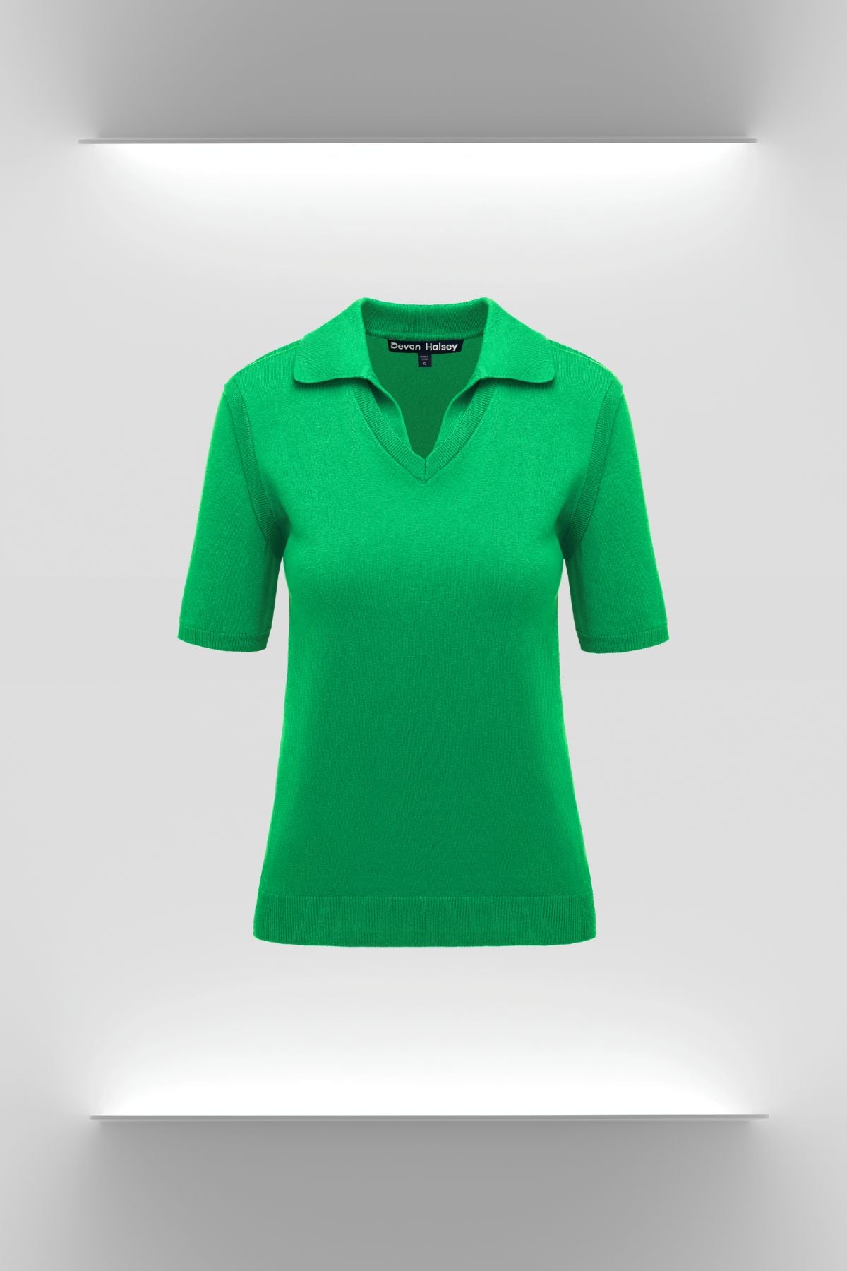Green cashmere shirt on a white background