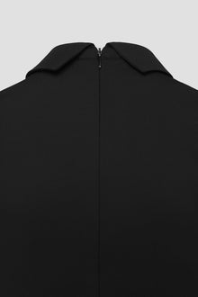 Close-up of a black Jana dress with a zipper
