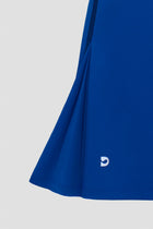 Blue golf dress with a small Devon Halsey logo 