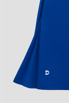 Blue golf dress with a small Devon Halsey logo 