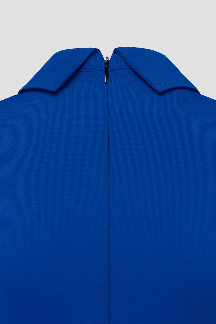 Close-up of a back side blue golf and tennis dress with a collar