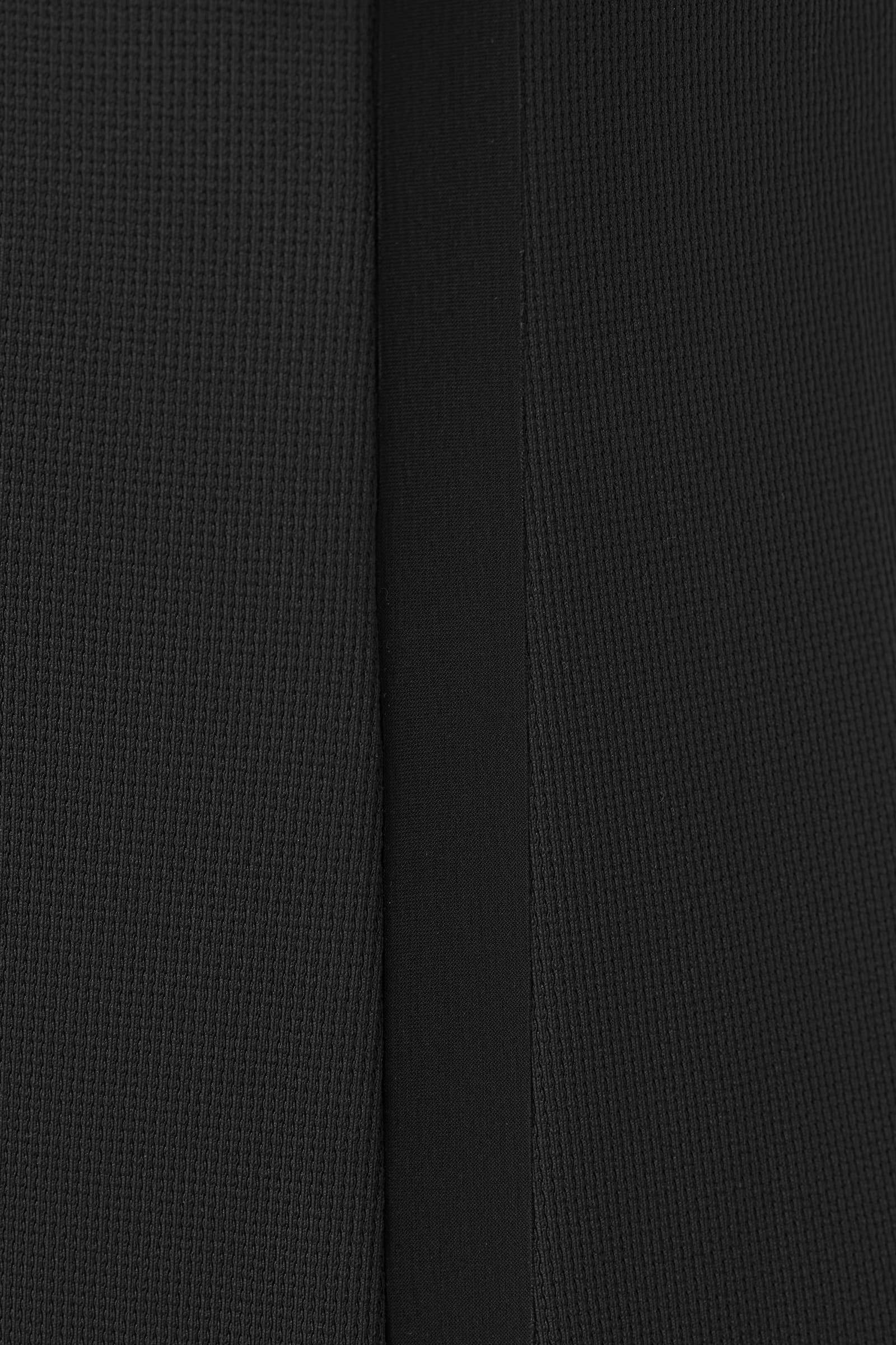 Close-up of a black pique knit texture