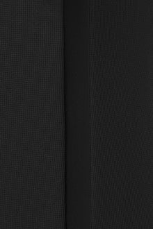 Close-up of a black pique knit texture