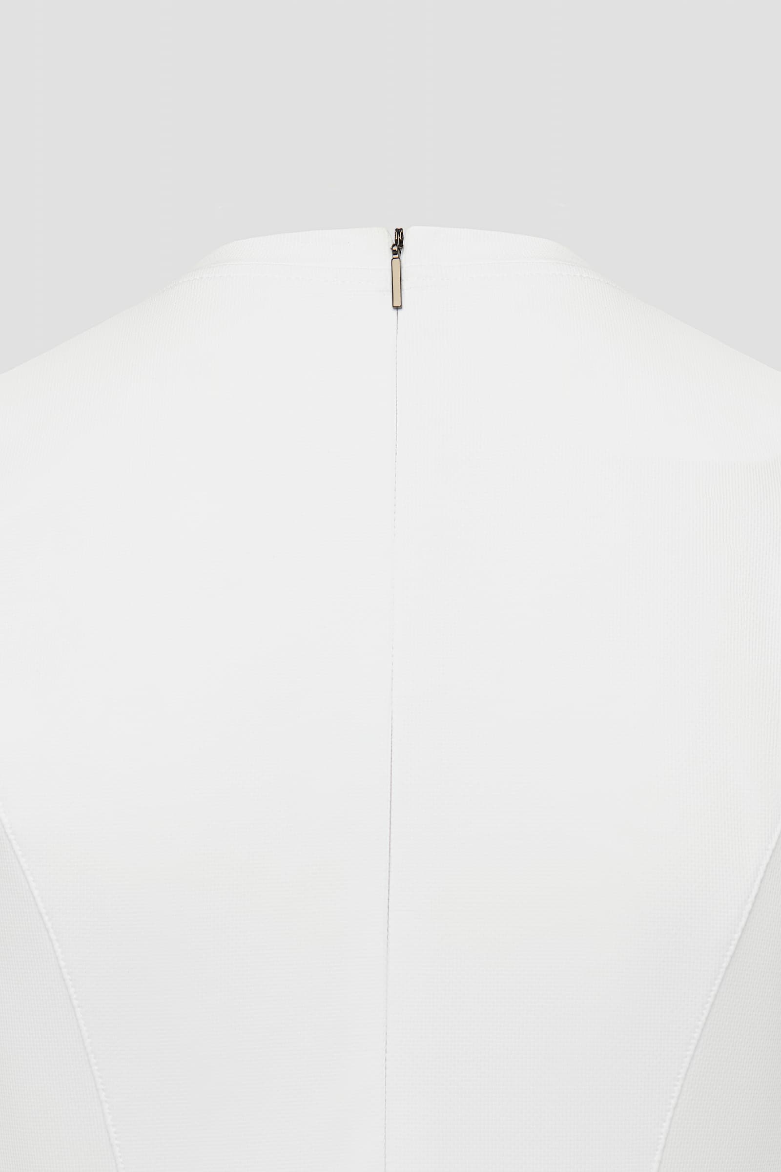 White athletic dress for women close up of zipper